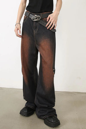 Dark wash palazzo jeans with faded brown accents and stud details.
