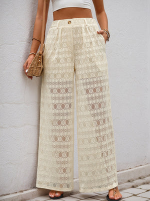 Cream lace palazzo trousers with button detail and wide leg cut.
