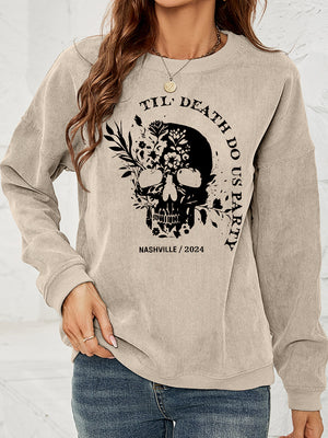 Sand corduroy sweatshirt with floral skull graphic and text.