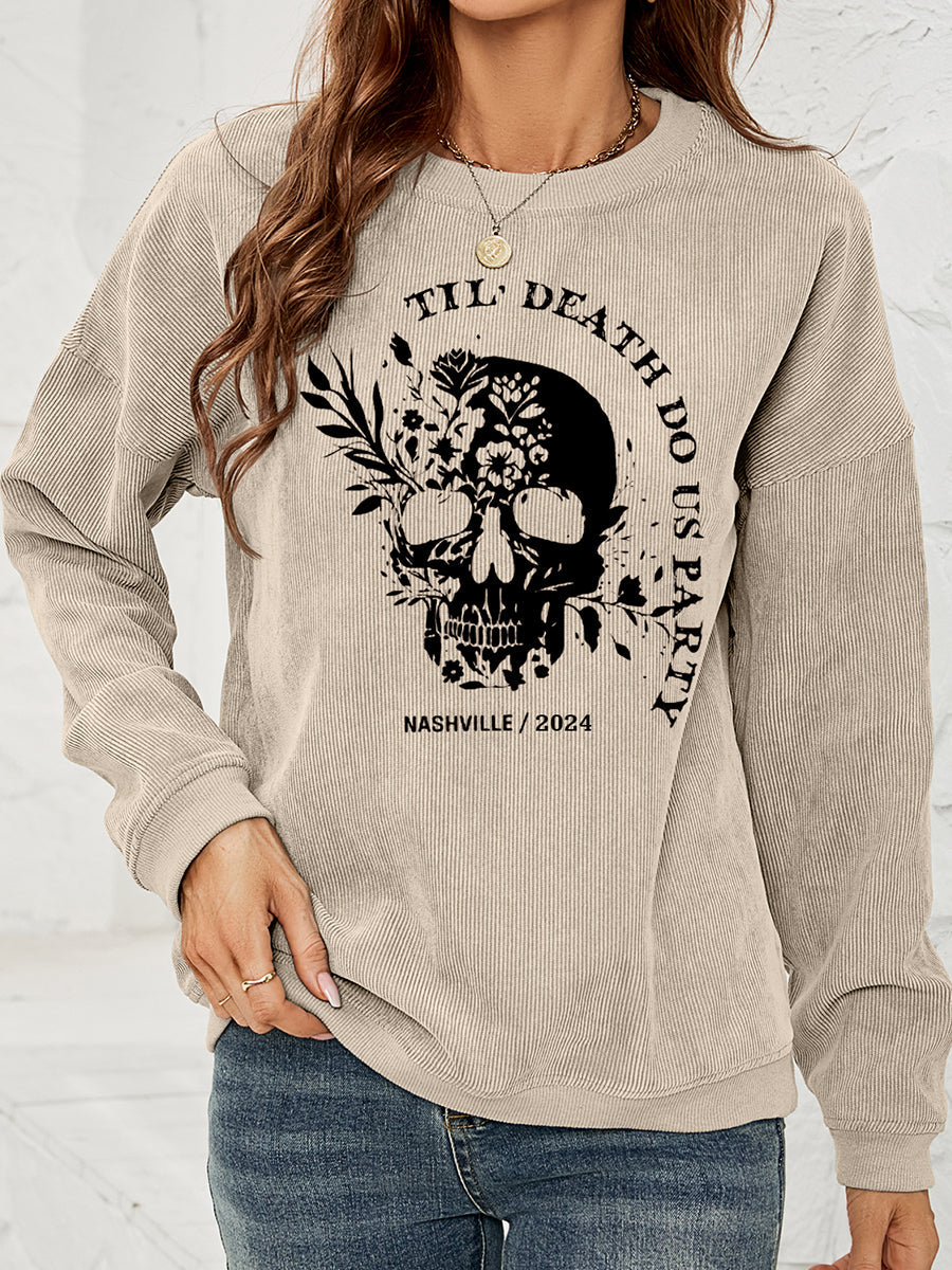 Sand corduroy sweatshirt with floral skull graphic and text.