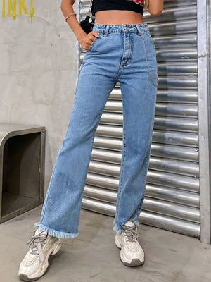 Light wash denim jeans with chain detail and frayed hem
