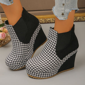 white ankle boots featuring wedge heel and houndstooth