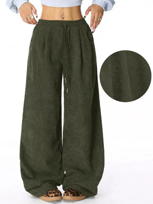 Relaxed fit army green corduroy pants with drawstring waist and wide leg.
