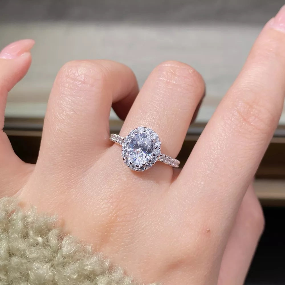 ring in silver featuring oval cut moissanite and oval halo fit