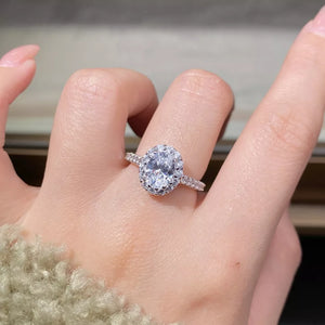ring in silver featuring oval cut moissanite and oval halo fit