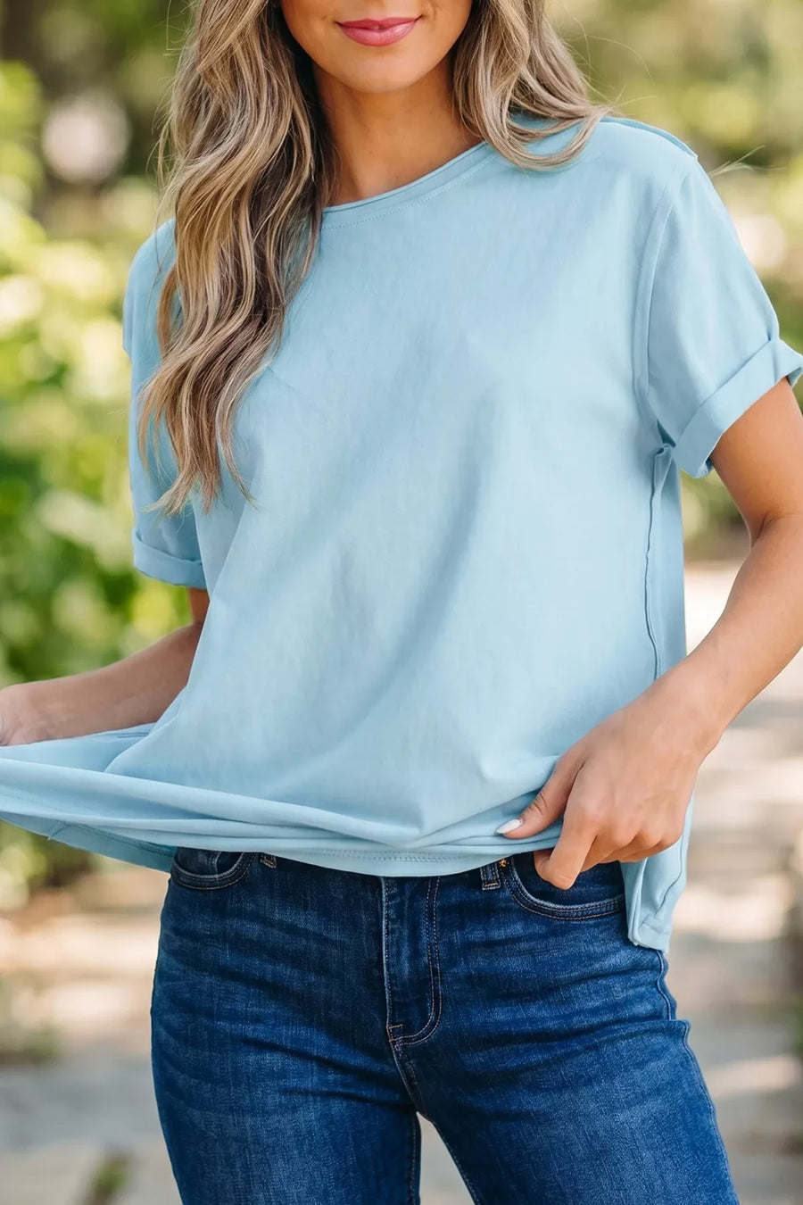 Light blue cotton blend t-shirt with round neck and cuffed short sleeves.