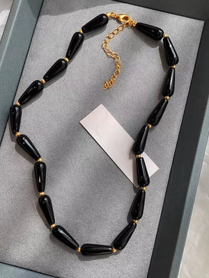 Elegant black agate teardrop choker necklace with gold accents