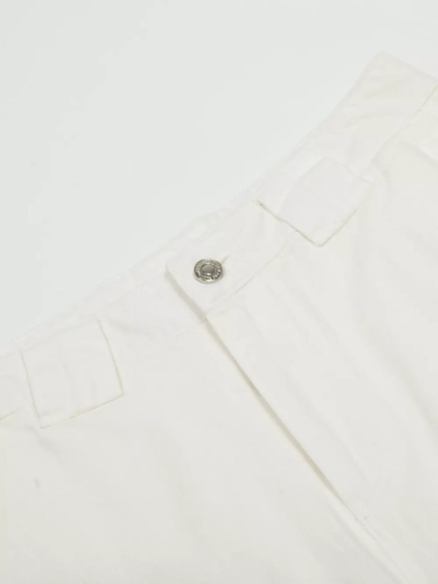 White men's capris with wide legs, a button closure, and belt loops.