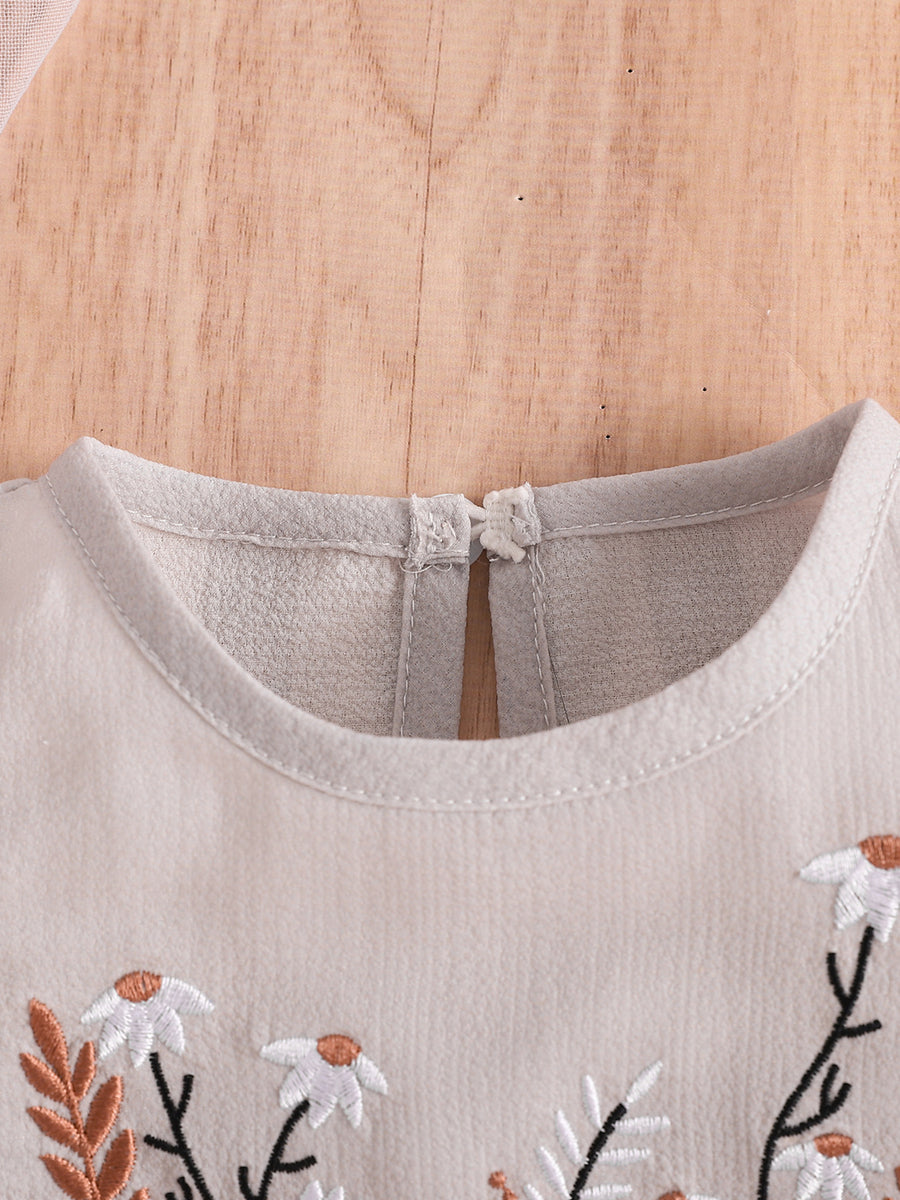 Baby girls' two-piece set in light beige with floral embroidery and button closure at the back.