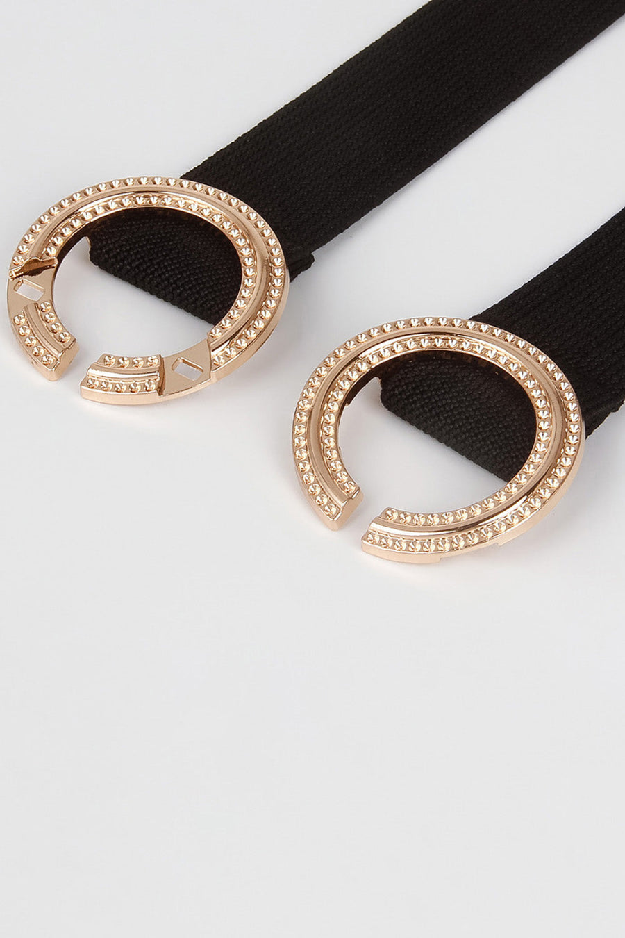 Black stretch belt with double embellished oval buckles and gold-tone alloy details.