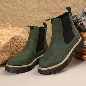 Green suede platform chelsea ankle boots with chunky sole and elastic side panels.