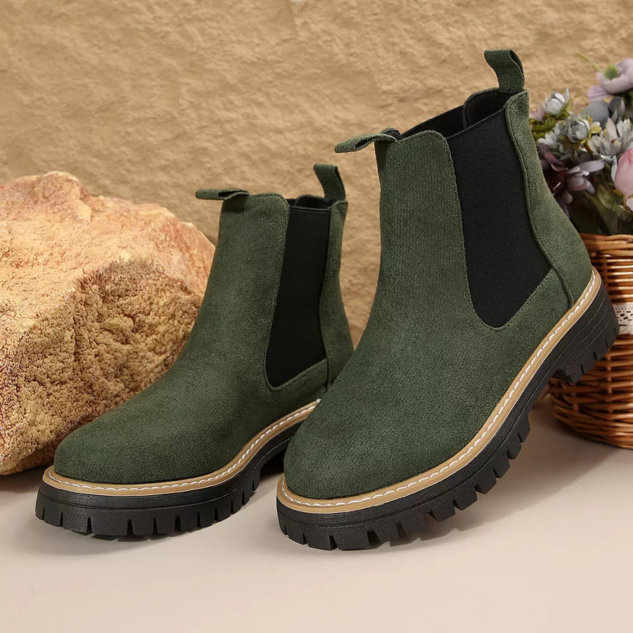 Green suede platform chelsea ankle boots with chunky sole and elastic side panels.