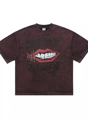 Burgundy crew neck t-shirt with edgy lip graphic and text.