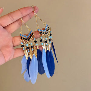 Blue feathered cascade earrings with enamel and bead details