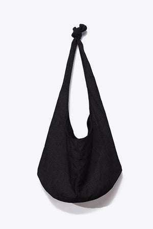 Black canvas shoulder bag with knotted strap detail