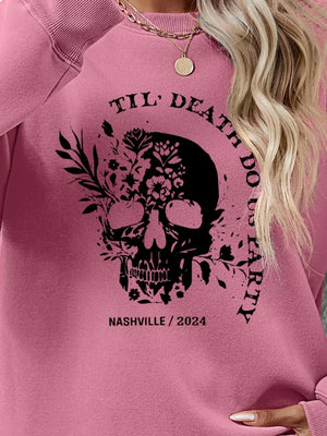 Blush Pink sweatshirt with floral skull graphic and text.