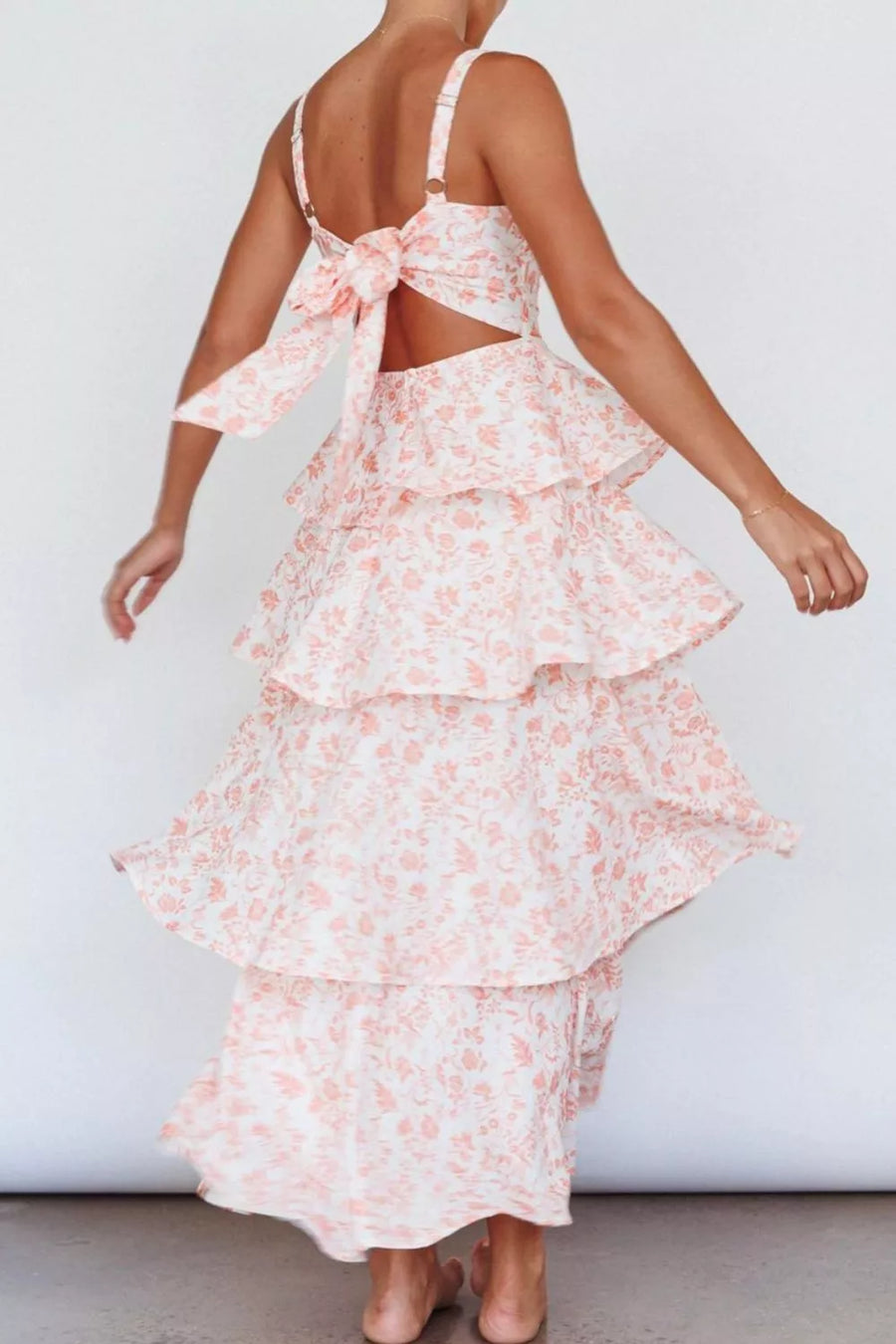 Tiered maxi dress with floral print and back bow detail