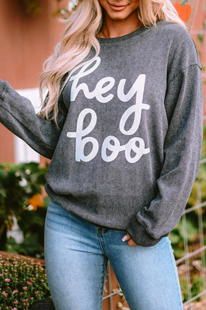 Textured dark gray sweatshirt with white "hey boo" graphic, crewneck, long sleeves, slouchy fit