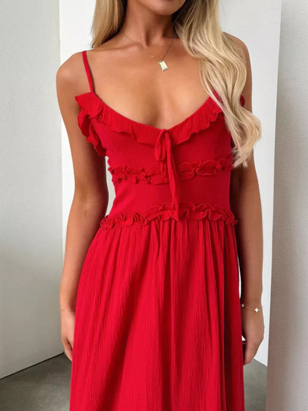 Red ruffled midi dress with spaghetti straps and tie-front neckline