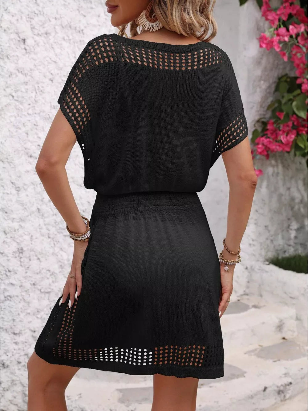 Black perforated knit V-neck cover-up dress with short sleeves and a drawstring waist.