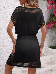 Black perforated knit V-neck cover-up dress with short sleeves and a drawstring waist.