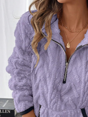 Purple sherpa half zip sweatshirt with textured fleece and a silver zipper.