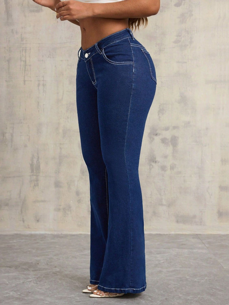 Dark wash denim flare jeans with contrast stitching and a sculpted fit.