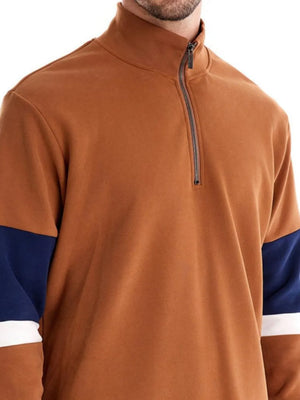 Colorblock zip-neck sweatshirt in caramel with navy and white sleeve details.