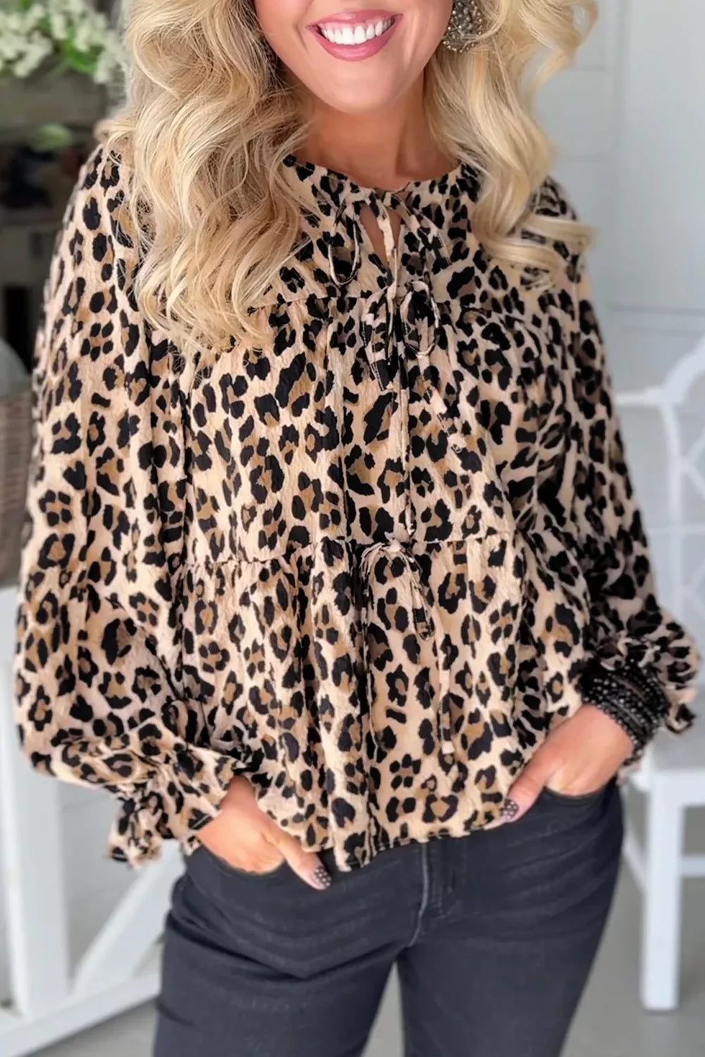 tan blouse with leopard-print and tie-neck