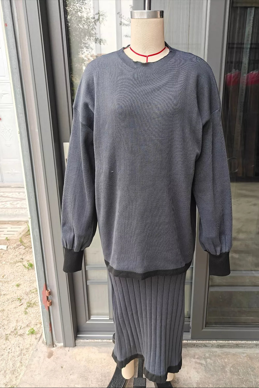 100% polyester Care instructions: Machine wash cold Sweater and Skirt Set in Dusty Blue with relaxed silhouette