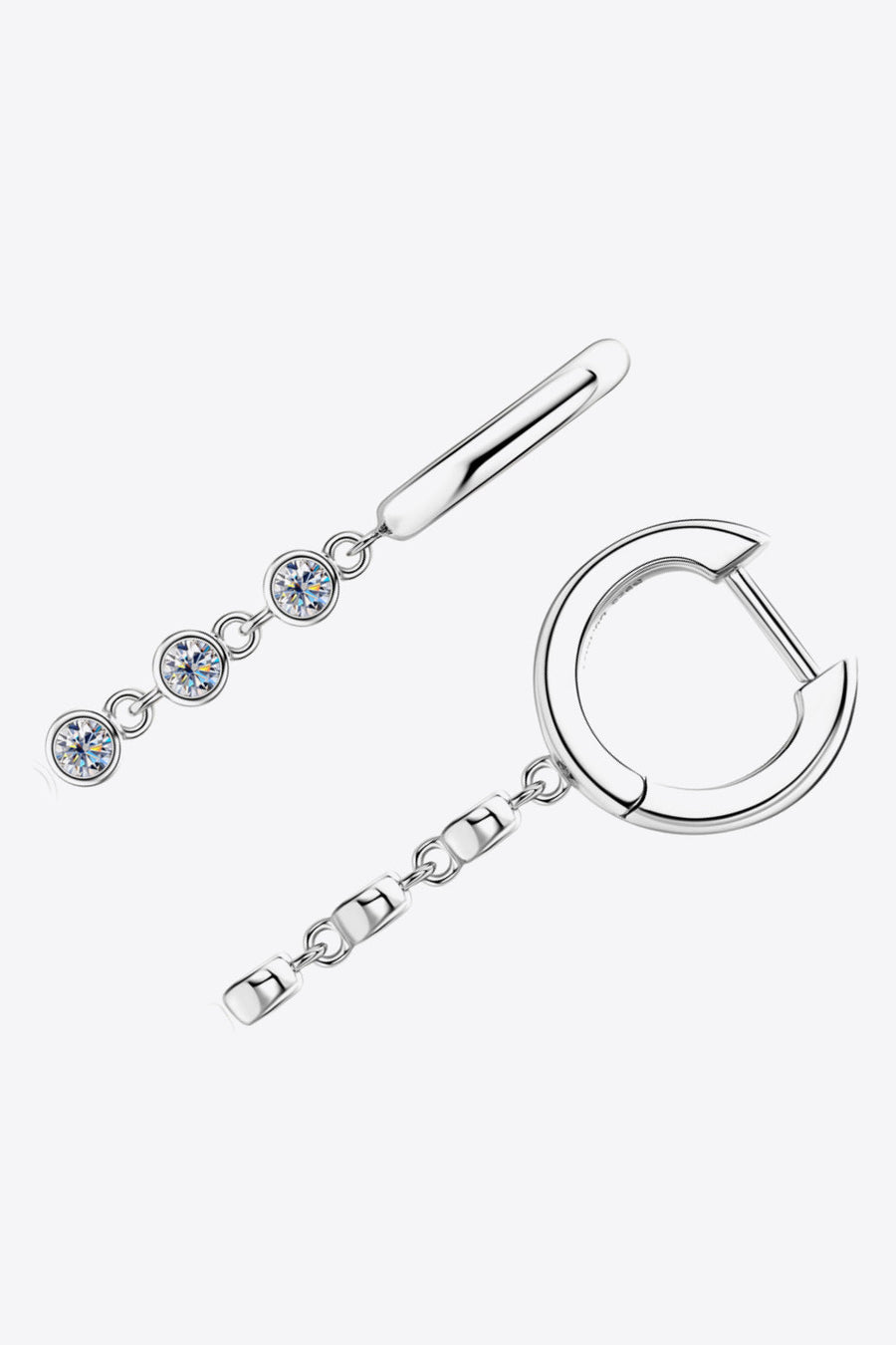 Silver hoop earrings with dangling chain featuring three clear gemstones and a bar accent.
