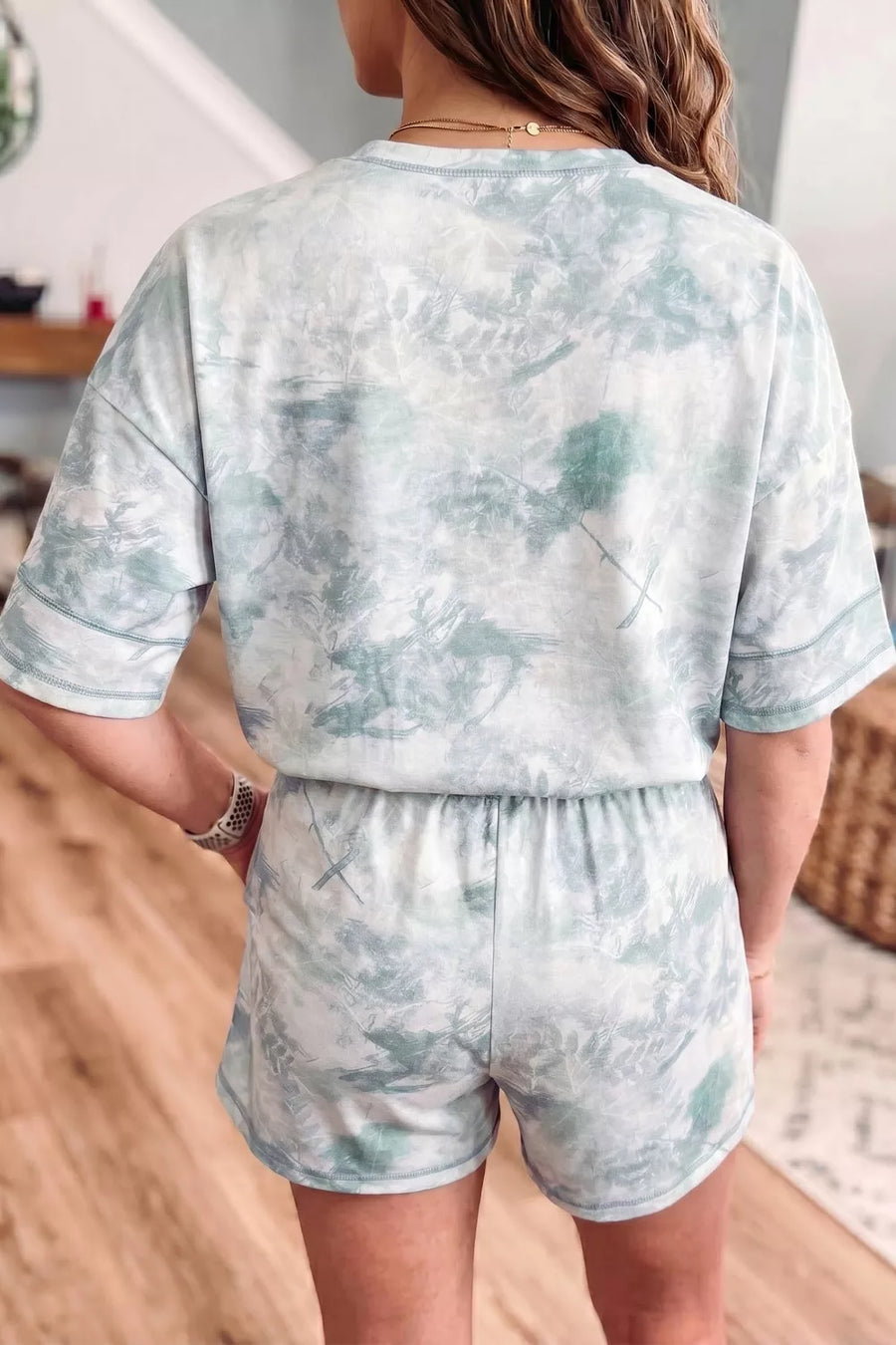 Tie-dye loungewear set with short sleeve top and elastic waist shorts in blue and white.