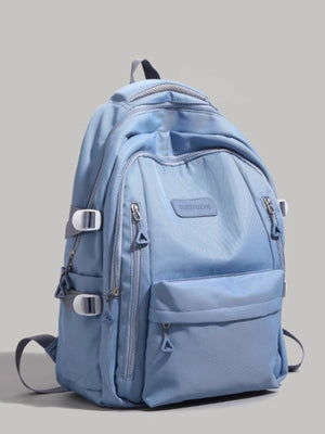 Large blue nylon backpack with multiple zippered pockets and adjustable straps.