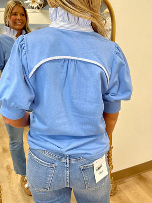 Chic blue cotton maternity shirt with puff sleeves, striped collar, and decorative back yoke detail.