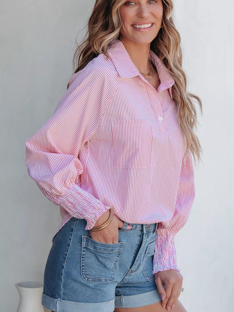 Pink and white striped button-up shirt with smocked cuffs and a chest pocket.