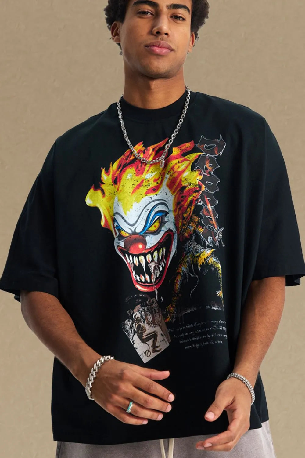 Black oversized t-shirt with a graphic print of a scary clown with flames.