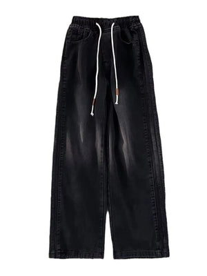 Black wide-leg drawstring jeans with a relaxed fit and denim material.