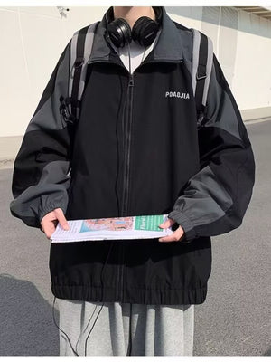 Black and grey colorblock zip-up jacket with text detail