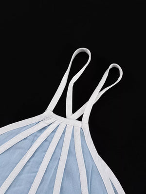 Light blue linen camisole with white strap details and a scoop neckline.