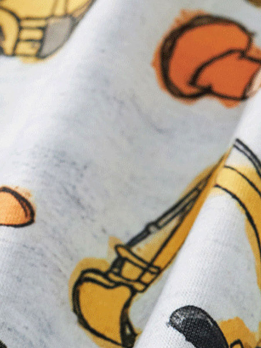 Toddler tee and shorts set with all-over construction vehicle print on white fabric.