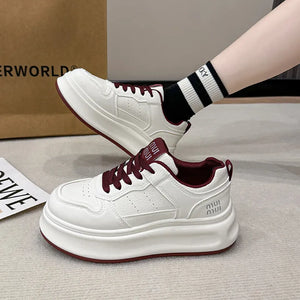 White platform court sneakers with burgundy laces and contrast detail