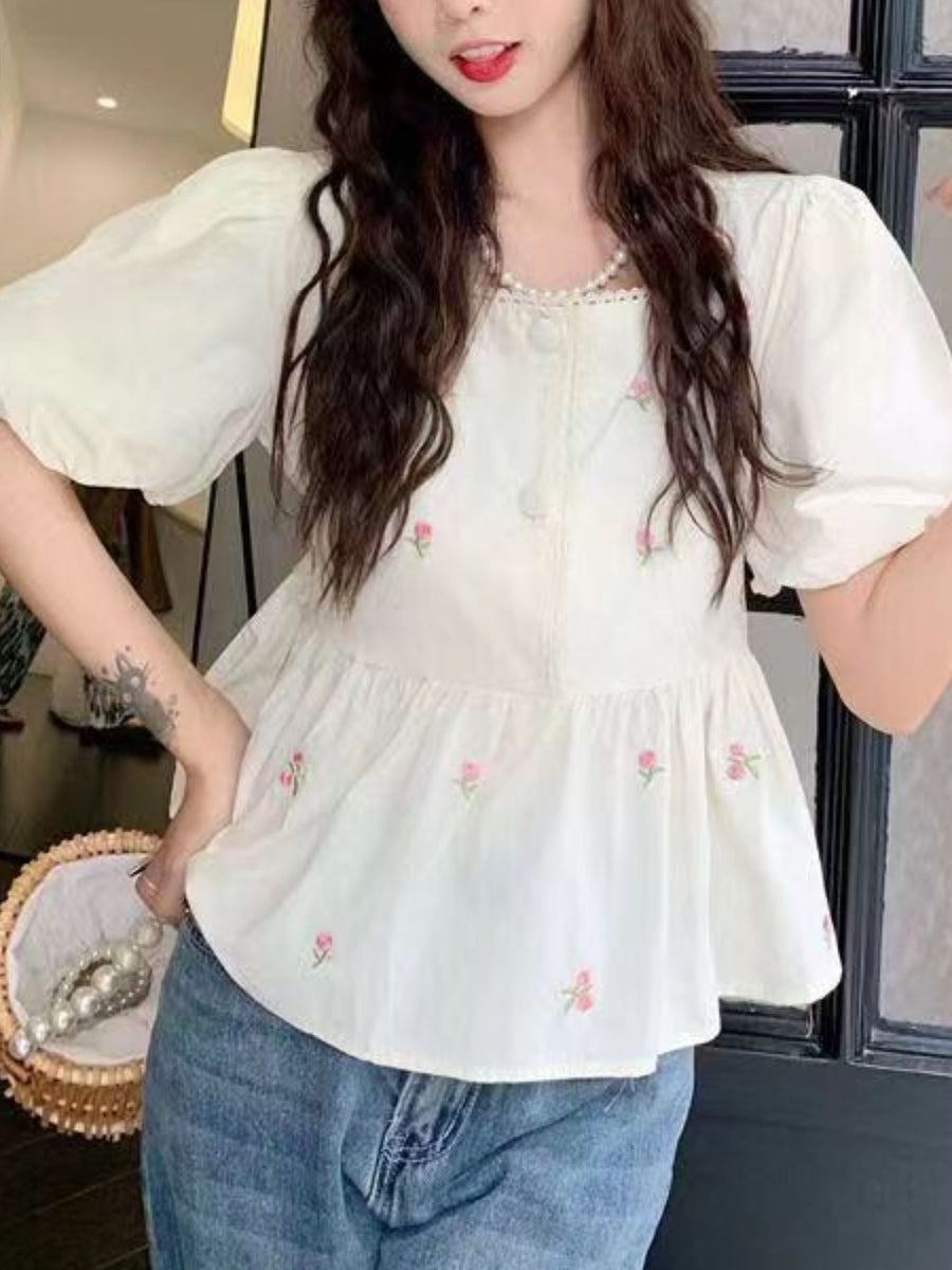cream blouse with lace detail and puff sleeve