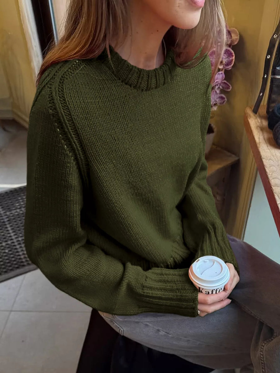 Army green ribbed round-neck knit sweater with textured shoulder detail.