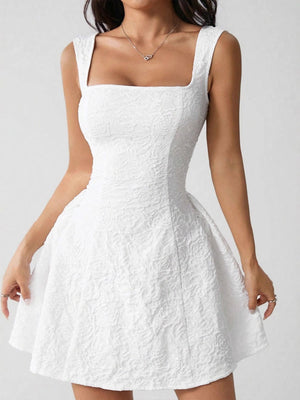 Textured white square neck mini dress with a fitted bodice and a-line skirt.
