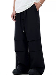 Black wide-leg drawstring jogger pants with layered detail