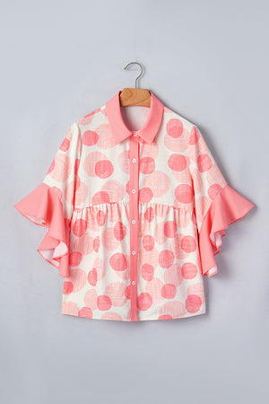 White and pink polka dot babydoll blouse with ruffle sleeves and button front.