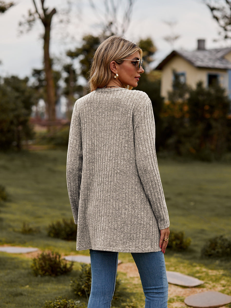 Longline ribbed knit button-down cardigan in beige with long sleeves and a relaxed fit.