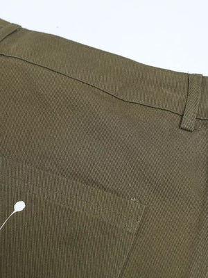 Olive green cotton cargo pants with white paint splatter detail and button fly.