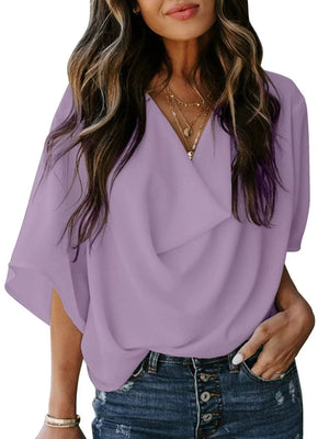 Light purple flowy half sleeve blouse with draped neckline and v-neck.