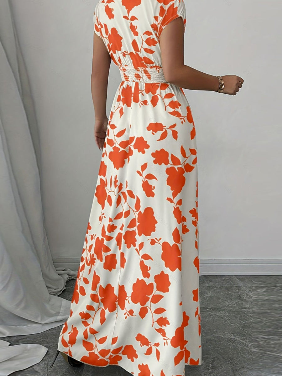 Maxi dress with orange floral print, cap sleeves, and smocked waist.